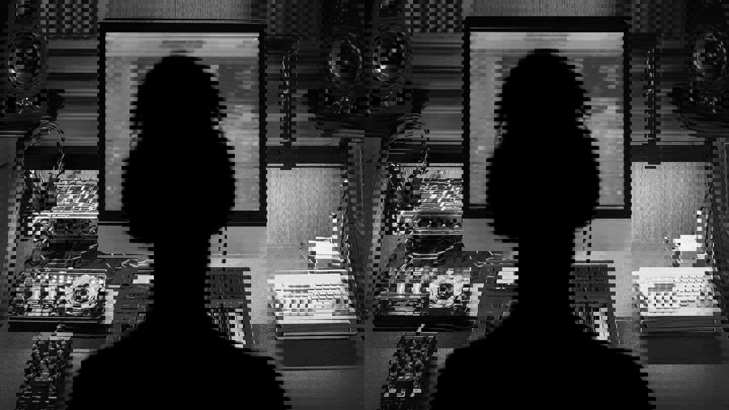 Man With Headphones Using Dolby Atmos Music Software to Create Music
