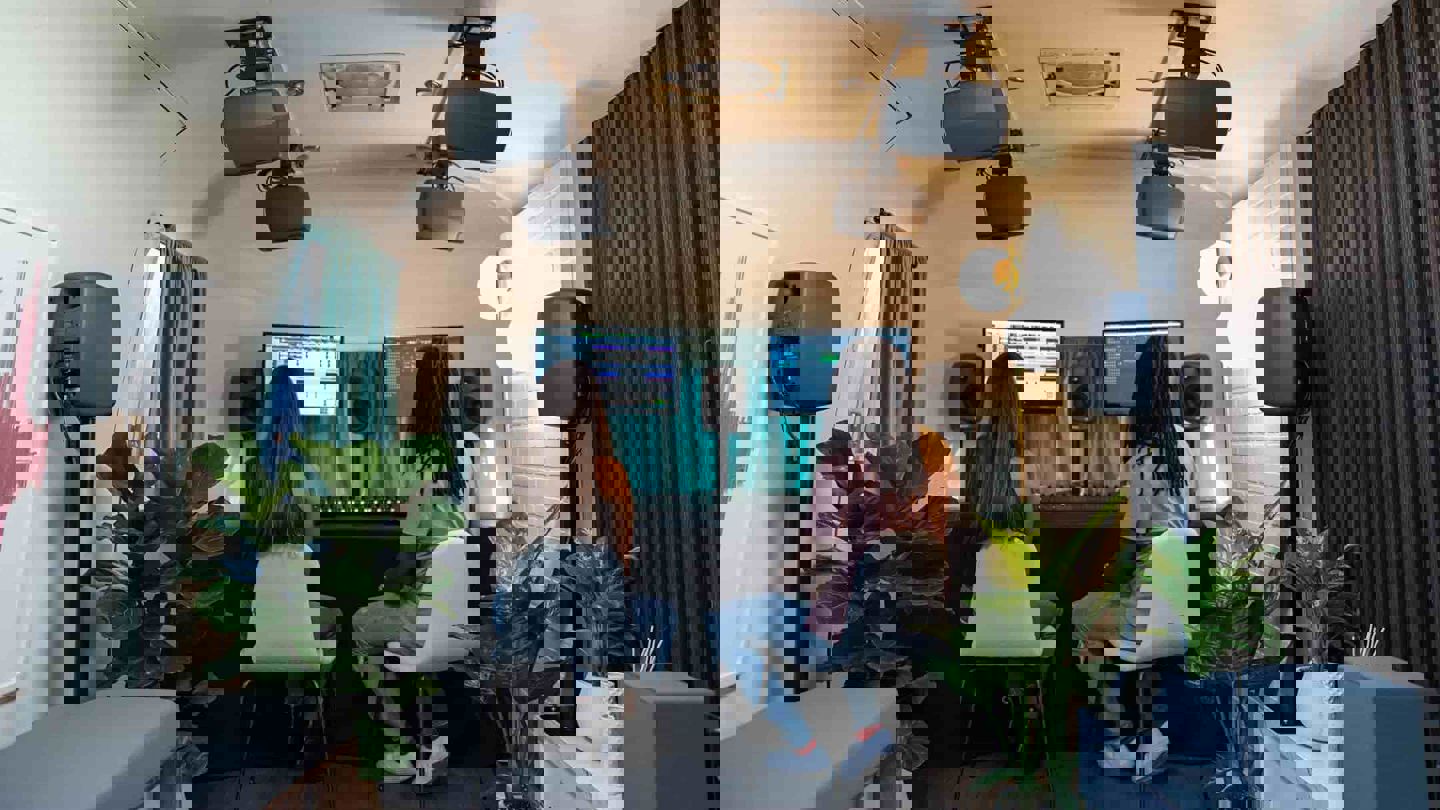 People Mixing Music Using Dolby Atmos